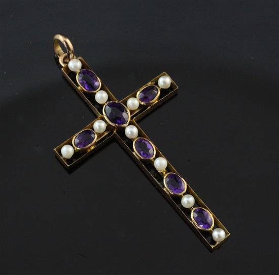 An Edwardian 9ct gold amethyst and seed pearl set cross pendant, 1.5in.